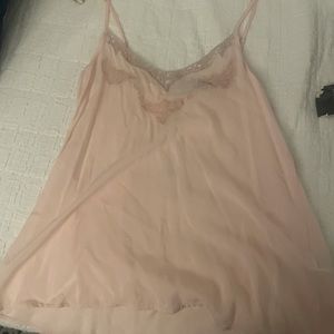 Pink spaghetti strap tank top with stitch and mesh detailing